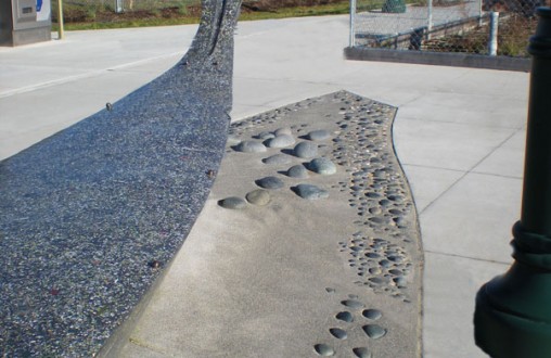 Decorative concrete Mukilteo North Platform - Site concrete, ADA ramps, hand seeded aggregates, embedded river rock, by Belarde Company  - Seattle, Washington